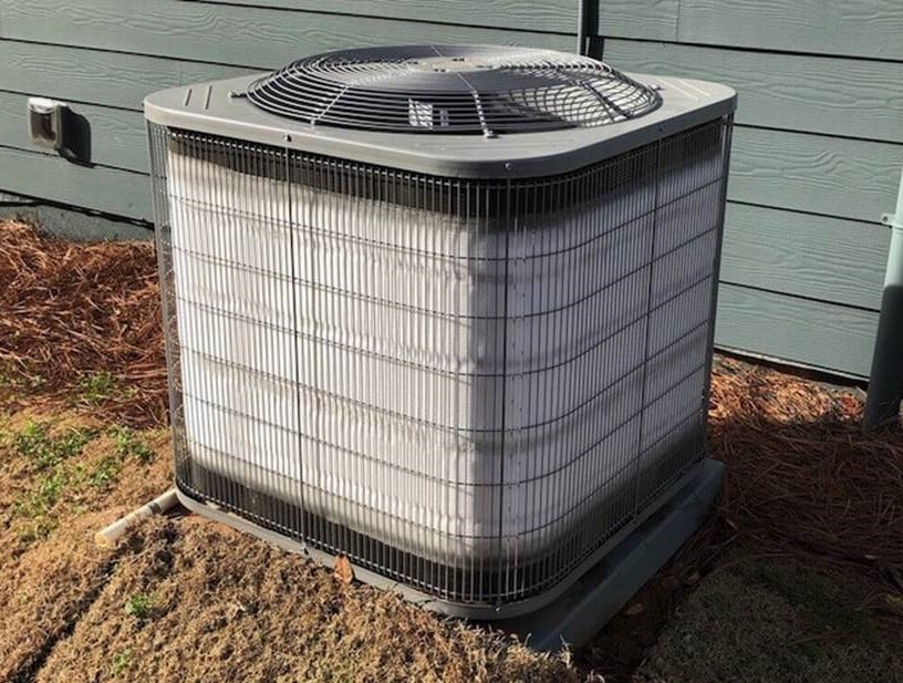 Outdoor AC unit with frozen condenser coils